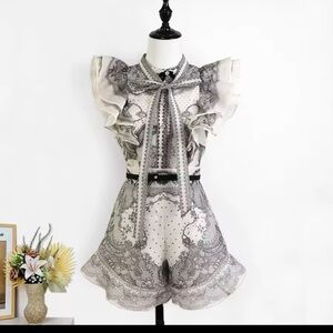 Elegant Black and White Lace Blouse and Shorts
